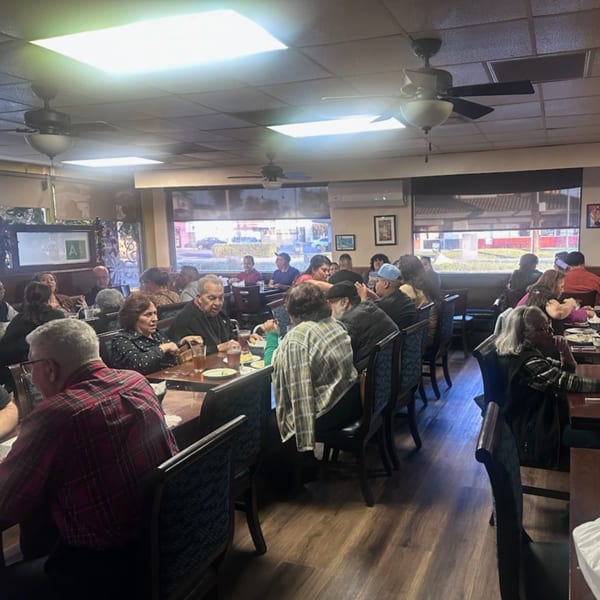 Diners enjoying meals and conversation at tables inside the Havana Club Restaurant & Bar.